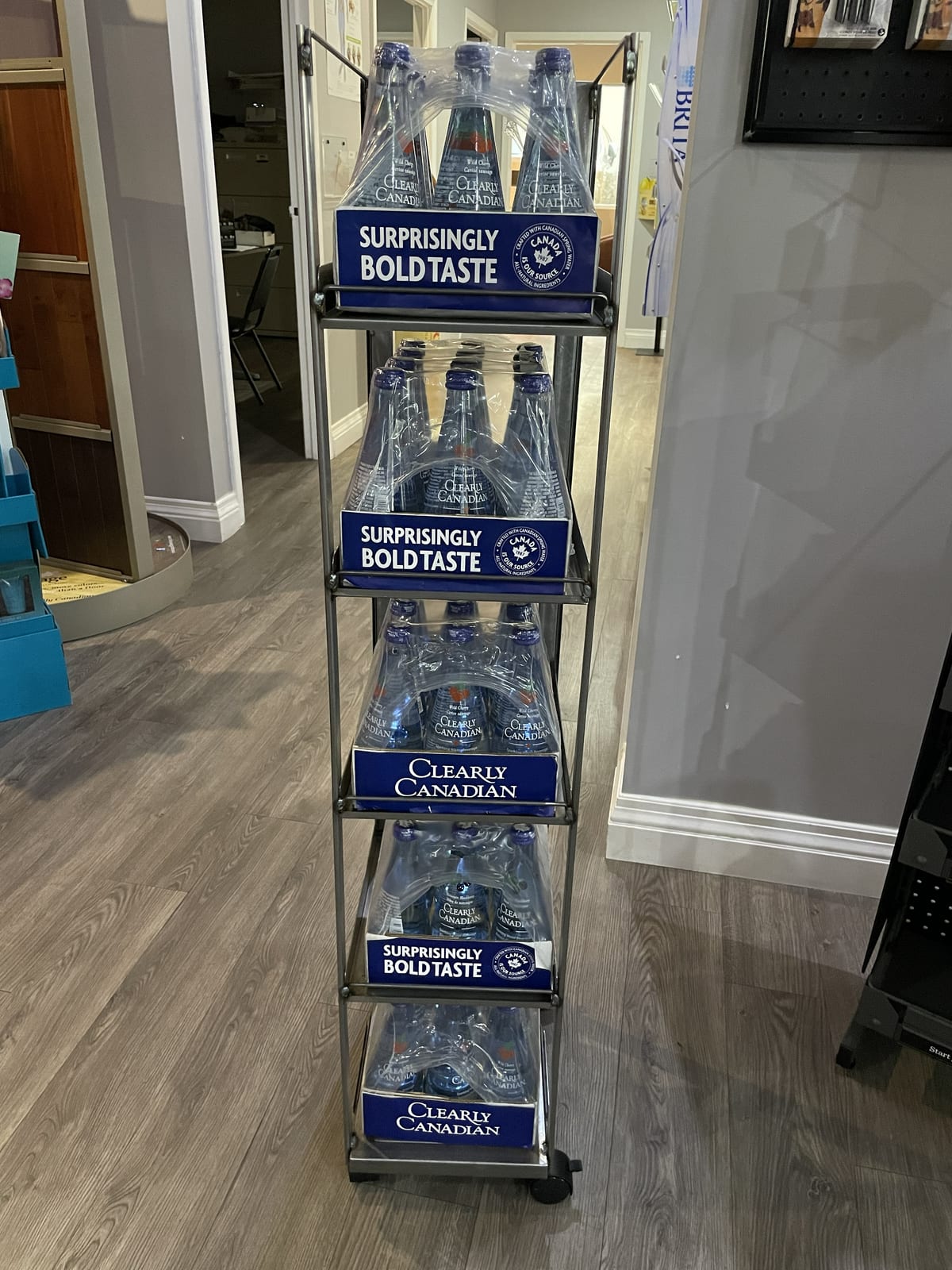 A built Clearly Canadian display loaded with product and branded shelf headers in store