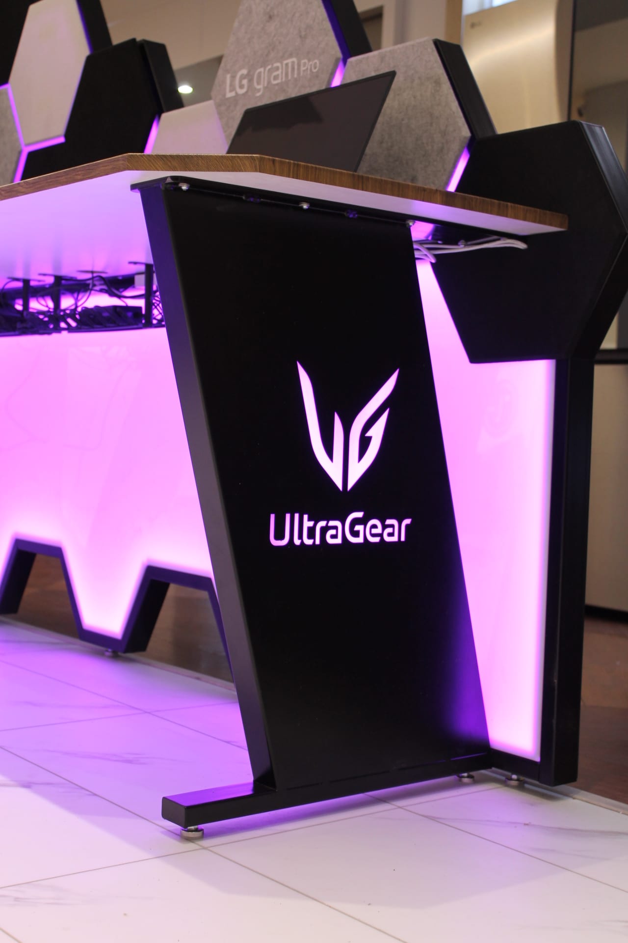 Close-up of the illuminated UltraGear logo on the gaming desk side panel
