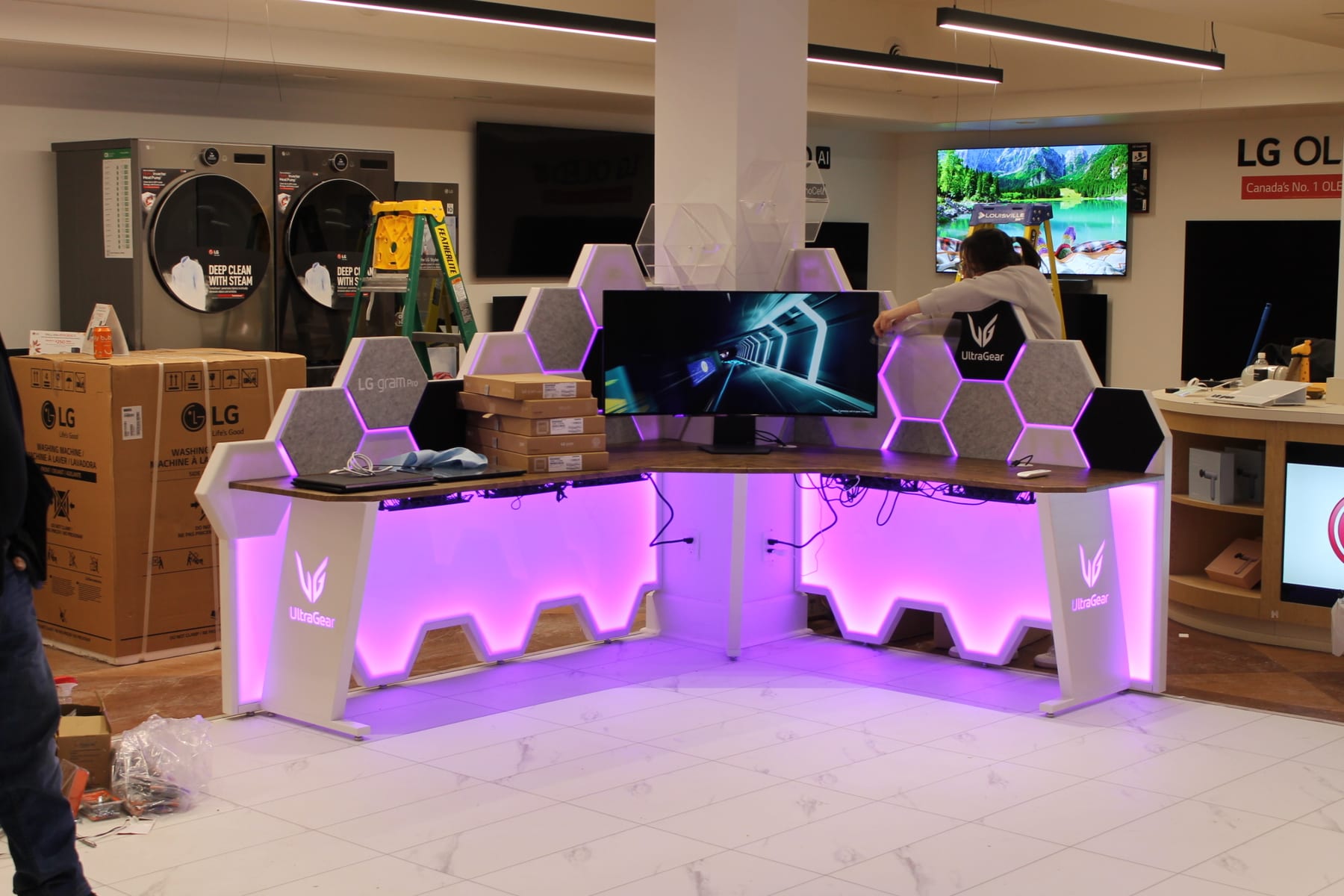 Both UltraGear gaming desk stations installed and lit on the LG Canada retail floor